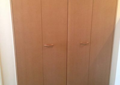 Custom wardrobe shelving bi-fold doors